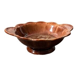 Vintage brown ceramic bowl with scalloped edges and a glossy finish,